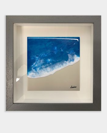 A ceramic tile with a shoreline depicted in resin and ink